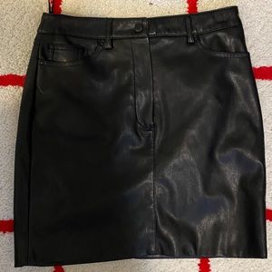 Faux leather mini skirt by Mango